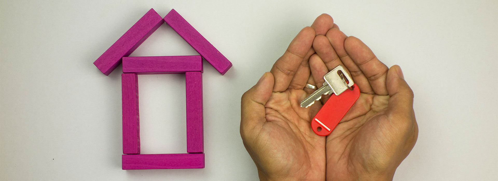 Hands holding house keys after dealing with a conveyancing solicitor